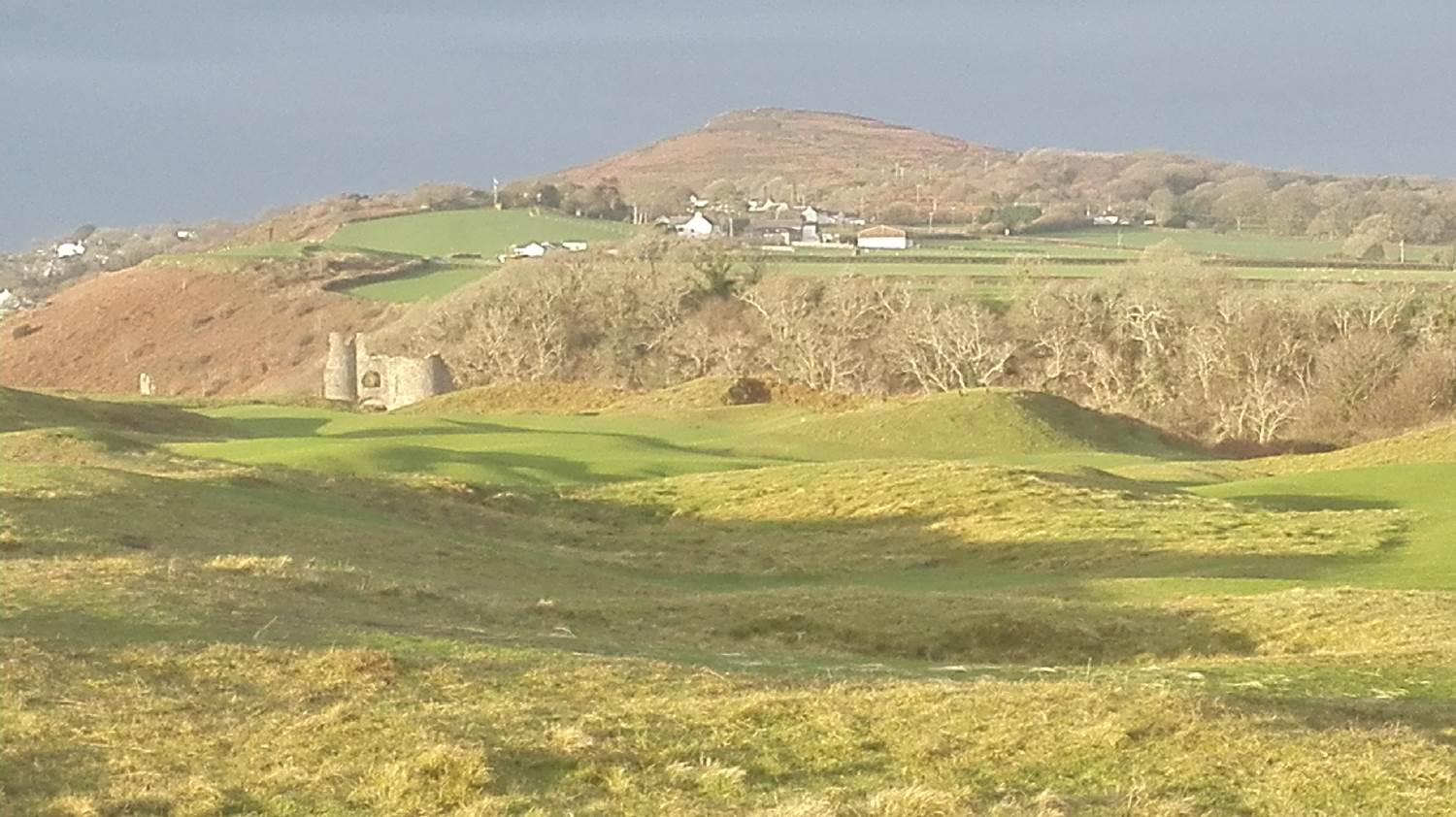 With Cefn Bryn in the background, and Pennard Castle on the edge of Pennard Golf Course, Gower shows off its shades of Green